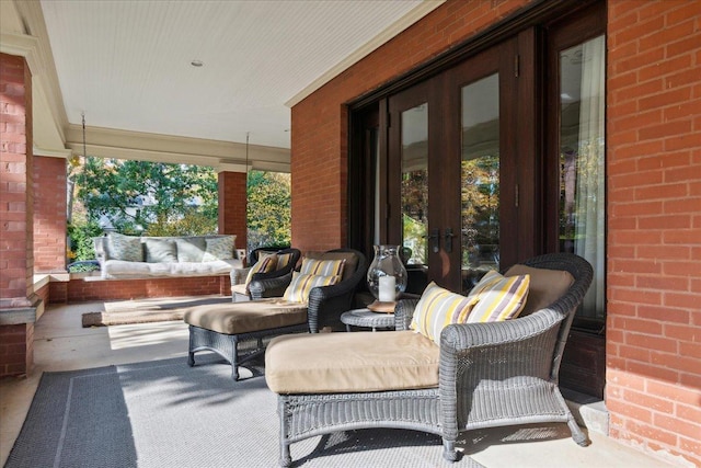 view of patio / terrace with covered porch and french doors