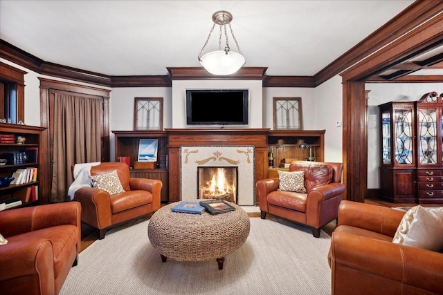 living room with ornamental molding and a fireplace