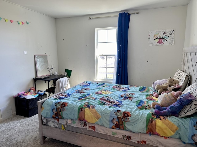 carpeted bedroom featuring multiple windows