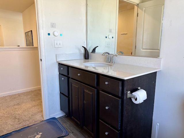 bathroom featuring vanity and baseboards
