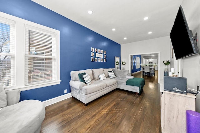 living room with recessed lighting, baseboards, and wood finished floors