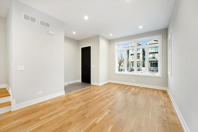 3502 S Union Ave, Chicago, IL 60609 - unfurnished room featuring light wood-type flooring, recessed lighting, and baseboards
