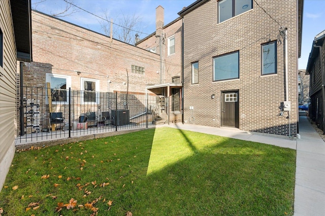 3502 S Union Ave, Chicago, IL 60609 - back of house featuring brick siding, a patio area, and cooling unit
