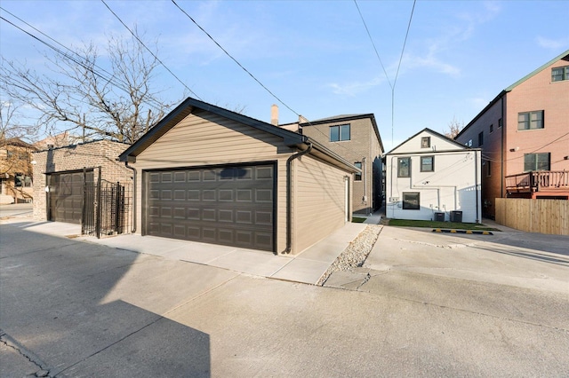 3502 S Union Ave, Chicago, IL 60609 - view of front of property with a detached garage, fence, and an outbuilding