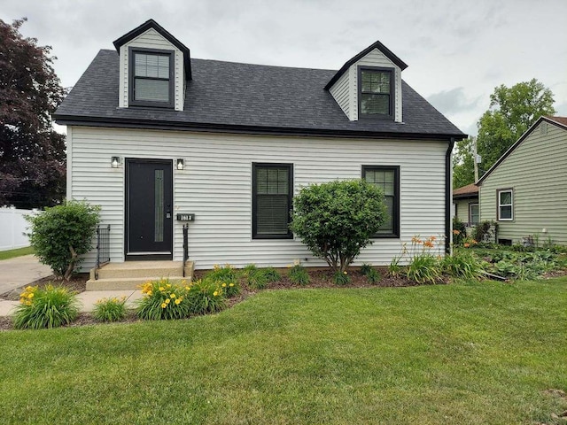 1613 Jones St, Joliet, IL 60435 - new england style home with a front yard and roof with shingles
