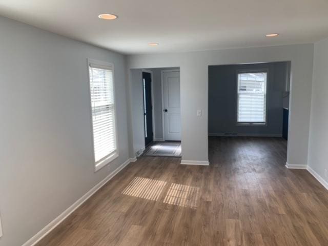 1613 Jones St, Joliet, IL 60435 - unfurnished room with dark wood-style flooring and recessed lighting