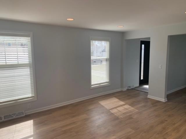 1613 Jones St, Joliet, IL 60435 - unfurnished room with plenty of natural light, wood finished floors, and recessed lighting