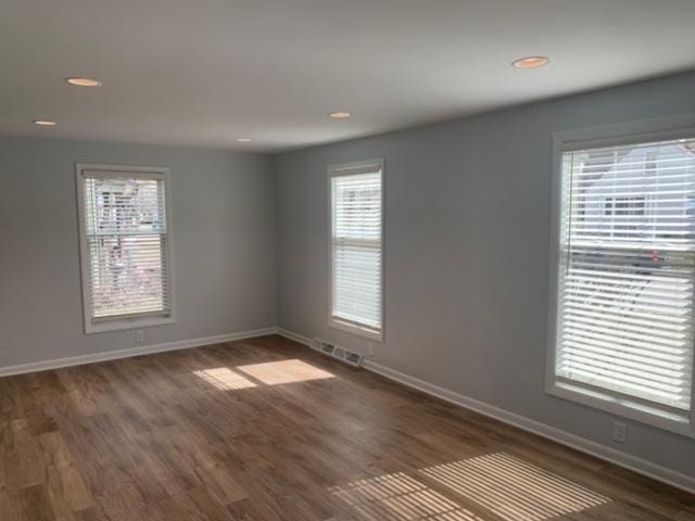 1613 Jones St, Joliet, IL 60435 - unfurnished room featuring dark wood-style flooring and recessed lighting