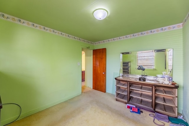 bedroom featuring carpet and baseboards