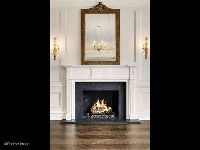 330 S County Line Rd, Hinsdale, IL 60521 - detailed view of a decorative wall, a chandelier, and a high end fireplace