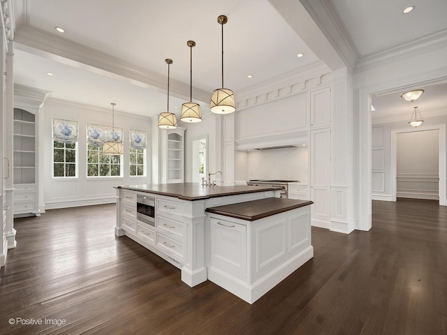 330 S County Line Rd, Hinsdale, IL 60521 - kitchen with a decorative wall, stainless steel appliances, butcher block countertops, crown molding, and dark wood-style floors