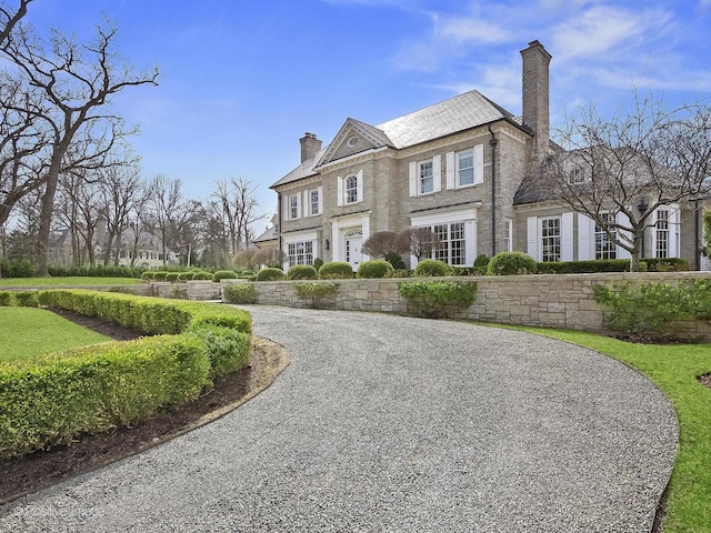 330 S County Line Rd, Hinsdale, IL 60521 - view of front facade featuring a chimney
