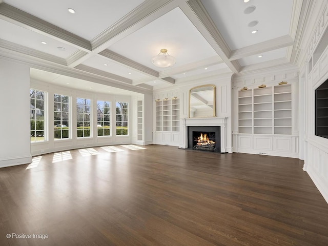 330 S County Line Rd, Hinsdale, IL 60521 - unfurnished living room with wood finished floors, a warm lit fireplace, ornamental molding, beam ceiling, and built in shelves