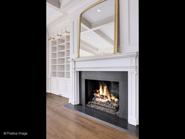 330 S County Line Rd, Hinsdale, IL 60521 - detailed view of crown molding, a lit fireplace, wood finished floors, built in shelves, and beamed ceiling