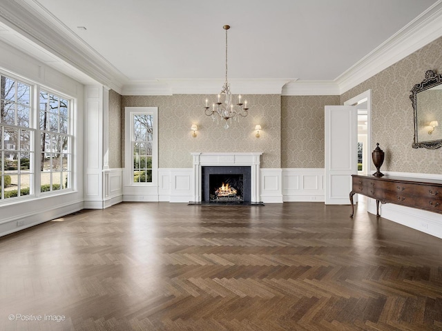 330 S County Line Rd, Hinsdale, IL 60521 - unfurnished living room featuring a chandelier, ornamental molding, a decorative wall, wainscoting, and a fireplace