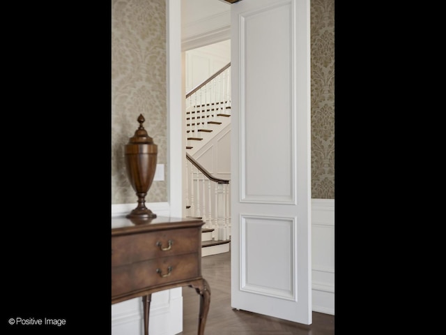 330 S County Line Rd, Hinsdale, IL 60521 - corridor featuring wallpapered walls, wainscoting, stairway, and a decorative wall