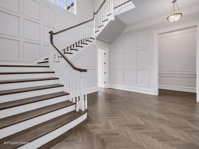 330 S County Line Rd, Hinsdale, IL 60521 - stairway with a decorative wall, crown molding, and a high ceiling