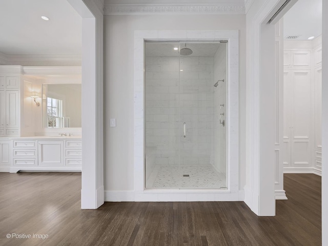 330 S County Line Rd, Hinsdale, IL 60521 - bathroom featuring a shower stall, wood finished floors, baseboards, vanity, and ornamental molding