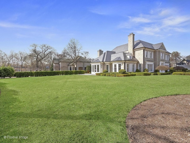 330 S County Line Rd, Hinsdale, IL 60521 - back of house with a lawn and a chimney