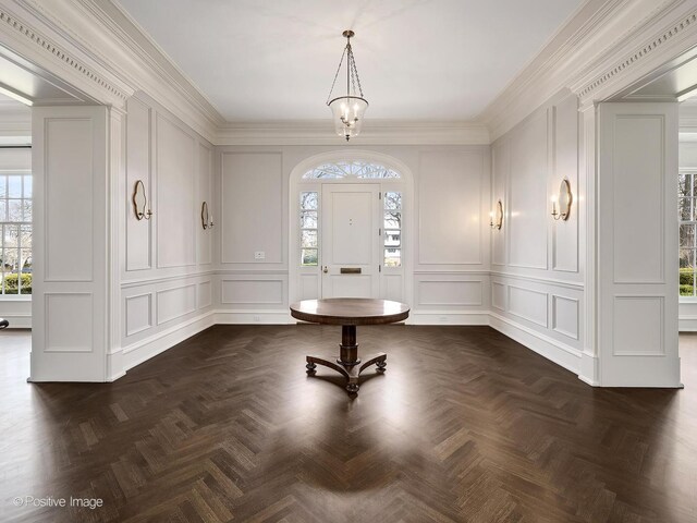 330 S County Line Rd, Hinsdale, IL 60521 - entrance foyer with a decorative wall, healthy amount of natural light, and ornamental molding