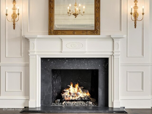 330 S County Line Rd, Hinsdale, IL 60521 - detailed view of a high end fireplace and a chandelier