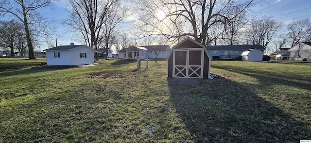 508 N Fayette, Carthage, IL 62321 - view of green lawn featuring a storage shed, an outbuilding, and a residential view