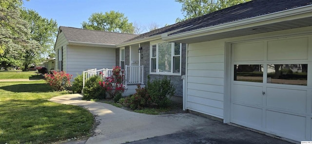 508 N Fayette, Carthage, IL 62321 - doorway to property featuring a lawn, a garage, and roof with shingles