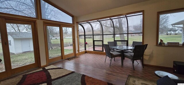 508 N Fayette, Carthage, IL 62321 - sunroom with wood finished floors, healthy amount of natural light, baseboards, and vaulted ceiling