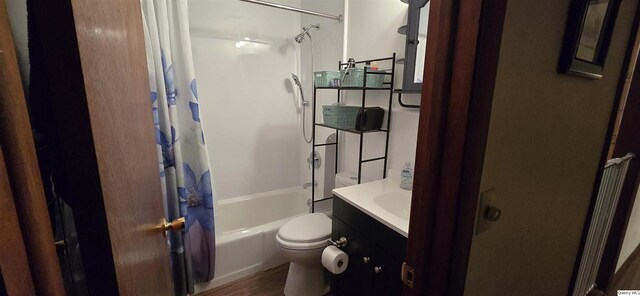 508 N Fayette, Carthage, IL 62321 - full bathroom featuring toilet, wood finished floors, shower / bath combination with curtain, and vanity