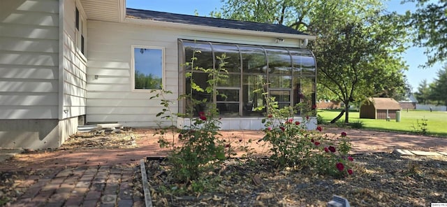 508 N Fayette, Carthage, IL 62321 - rear view of property featuring a sunroom