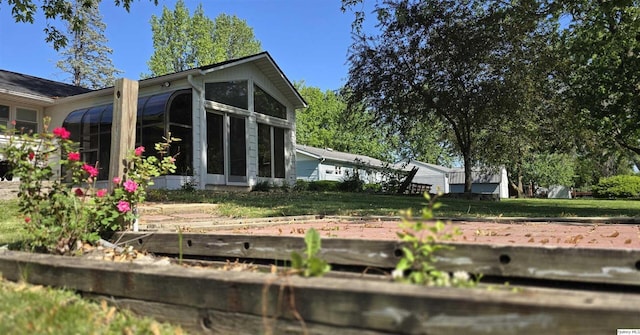 508 N Fayette, Carthage, IL 62321 - back of property with a sunroom and a yard