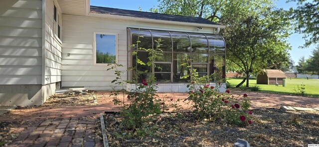 508 N Fayette, Carthage, IL 62321 - back of house featuring a sunroom