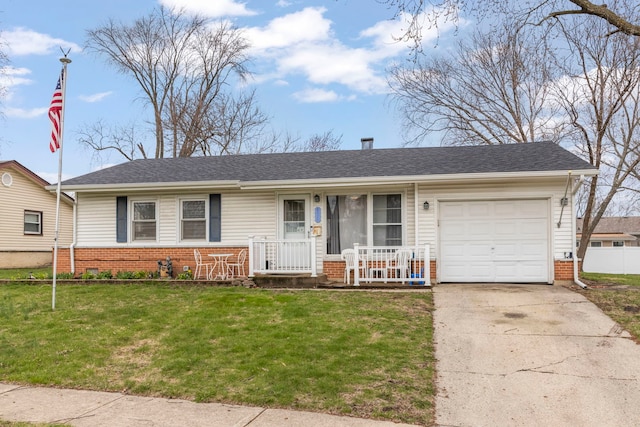 single story home with brick siding, an attached garage, a front lawn, and concrete driveway