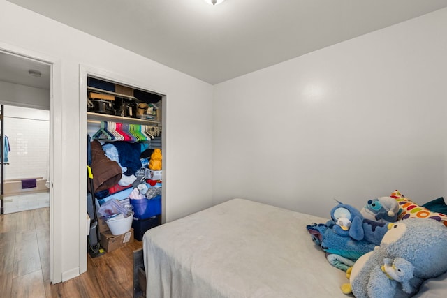 bedroom featuring a closet and wood finished floors