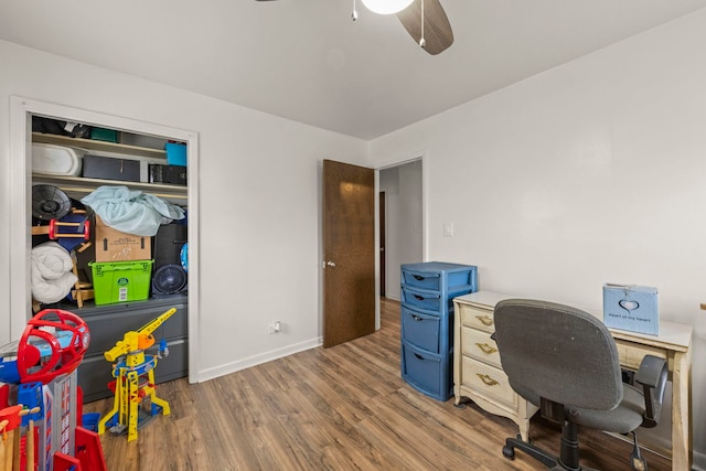 office with wood finished floors, ceiling fan, and baseboards