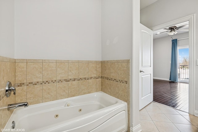 7170 W Grand Ave Unit 3E, Chicago, IL 60707 - full bath with tile patterned flooring, a jetted tub, baseboards, and a ceiling fan