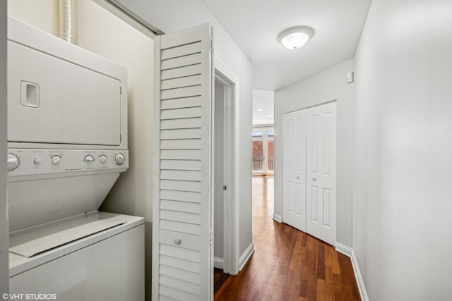 7170 W Grand Ave Unit 3E, Chicago, IL 60707 - laundry area featuring baseboards, dark wood-style flooring, stacked washer and dryer, and laundry area