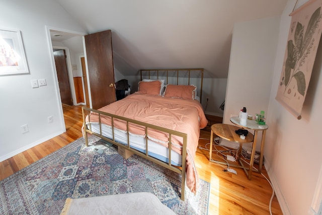 1304 N Campbell Ave, Chicago, IL 60622 - bedroom with baseboards, wood finished floors, and vaulted ceiling