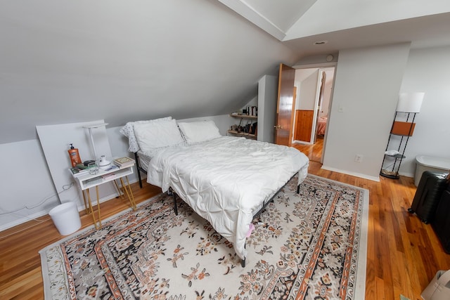 1304 N Campbell Ave, Chicago, IL 60622 - bedroom featuring baseboards, wood finished floors, and lofted ceiling