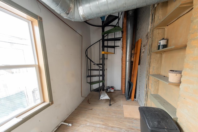 1304 N Campbell Ave, Chicago, IL 60622 - below grade area featuring light wood-style floors and stairway