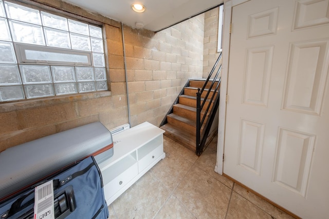 1304 N Campbell Ave, Chicago, IL 60622 - interior space with stairs, light tile patterned flooring, and concrete block wall