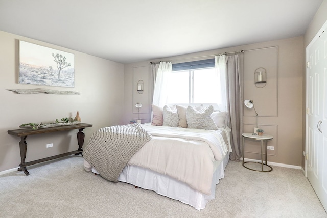 bedroom featuring baseboards and carpet flooring