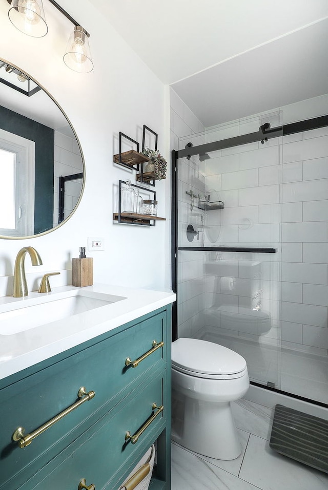 full bath with vanity, marble finish floor, a stall shower, and toilet