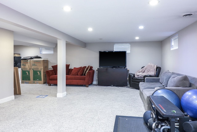 carpeted living room featuring baseboards, visible vents, and recessed lighting