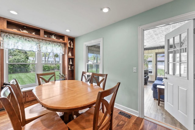 23610 N Overhill Dr, Lake Zurich, IL 60047 - dining room featuring plenty of natural light, wood finished floors, recessed lighting, and baseboards