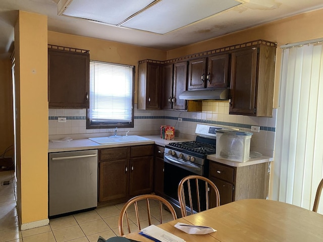 1938 Wildwood Cir, Glendale Heights, IL 60139 - kitchen with a sink, stainless steel appliances, light countertops, under cabinet range hood, and backsplash