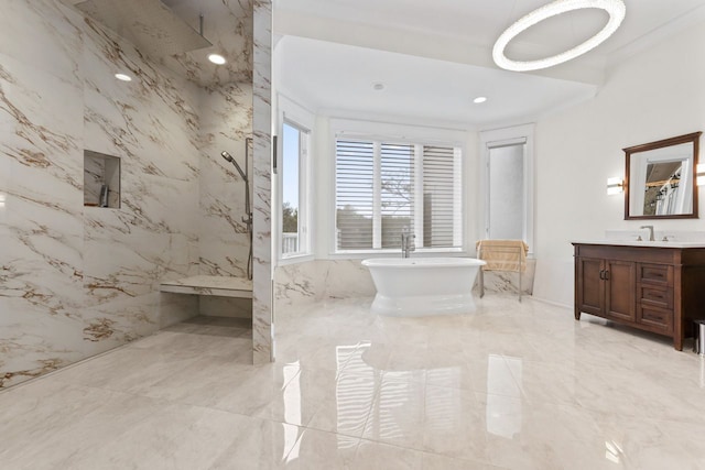 bathroom with a freestanding bath, a marble finish shower, marble finish floor, and vanity