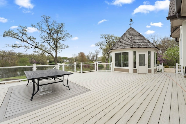 wooden terrace with outdoor dining space