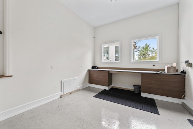 bathroom with vanity and baseboards