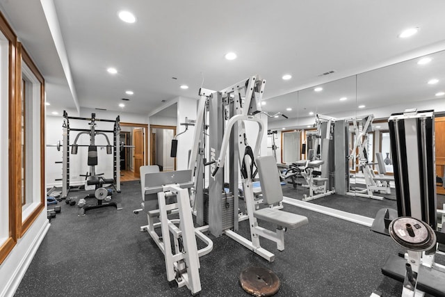 exercise room with visible vents and recessed lighting
